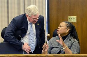 Senator Locke conferring with Senator John Miller.